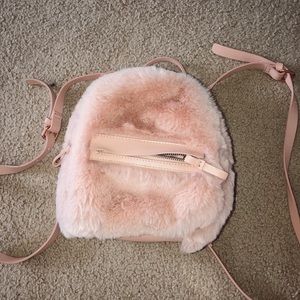 AE fluffy mini backpack/clutch